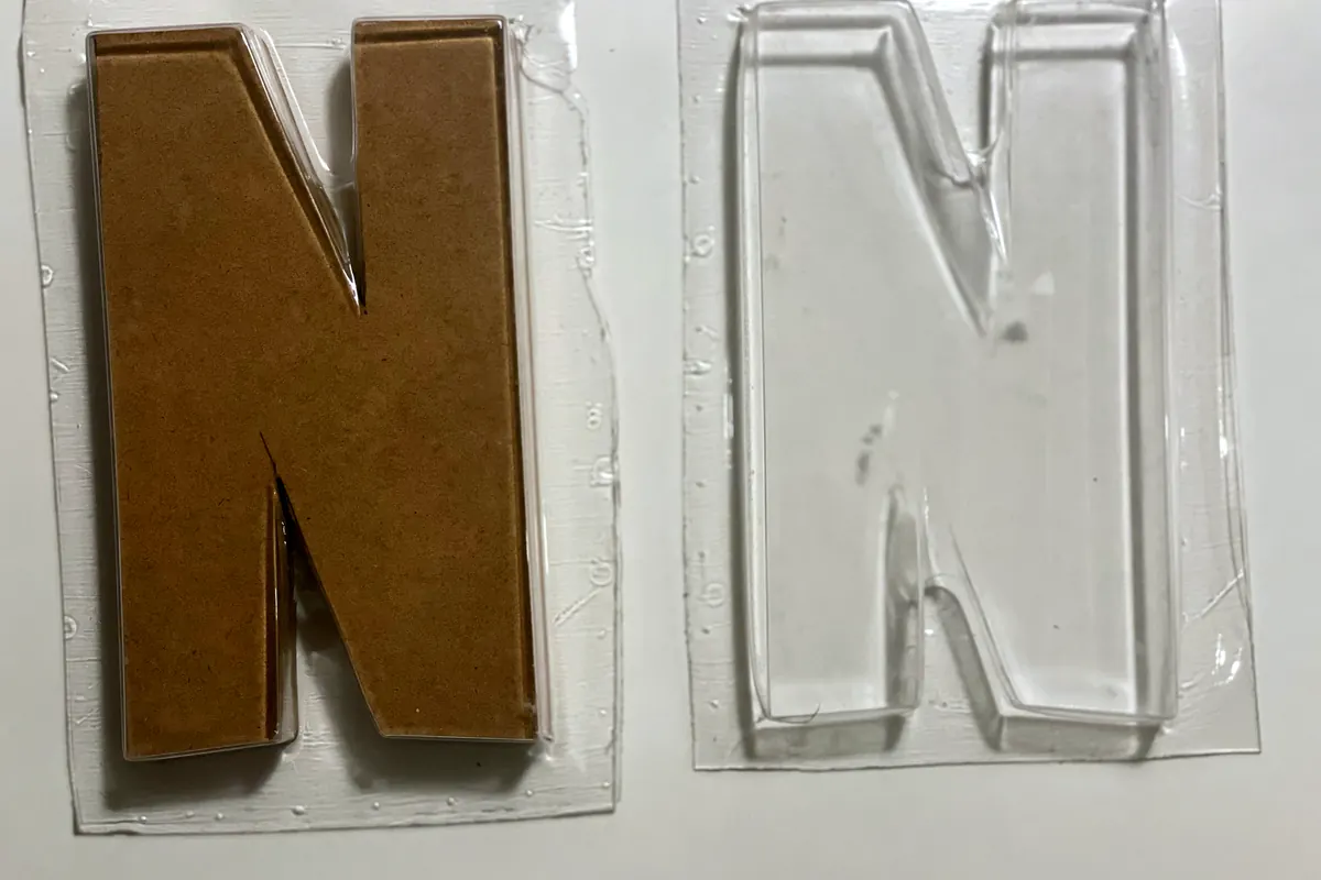 Two N-shaped moulds, one filled with substrate, one empty