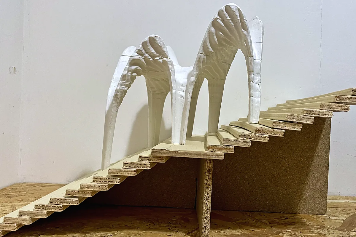 3D printed white ribbed shells on a model of a staircase