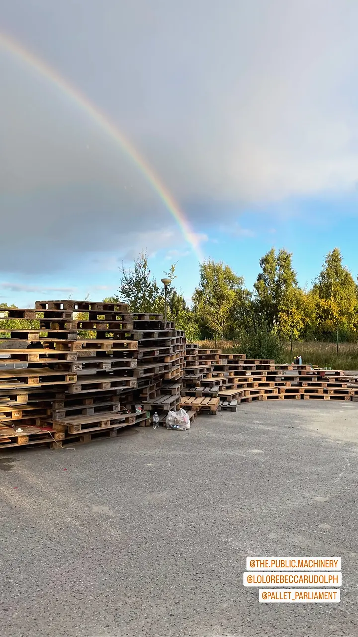 Story: the stacked pallets under a rainbow